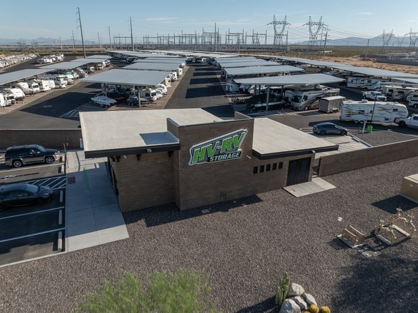 An RV and boat storage facility with covered canopy rows and an office building